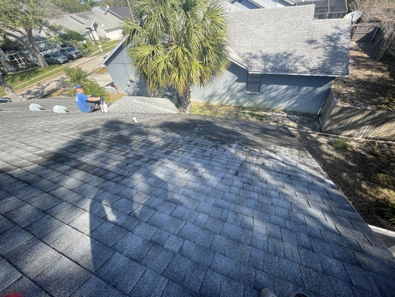 Clean shingle roof and driveway after washing